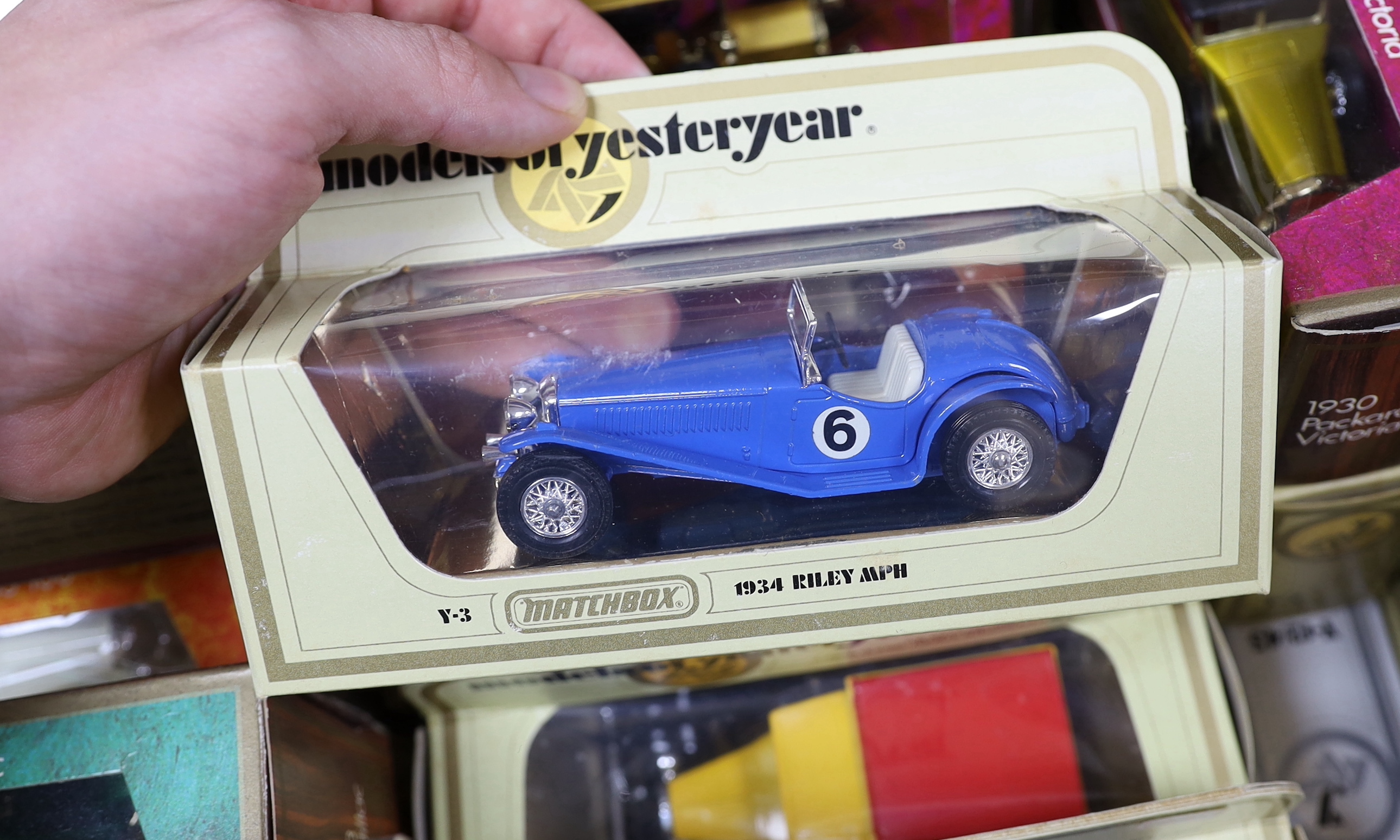 A collection of boxed Matchbox Models of Yesteryear (94 vehicles) in a variety of era boxes, mostly cream window boxes, some ‘wood effect’ boxes, etc.